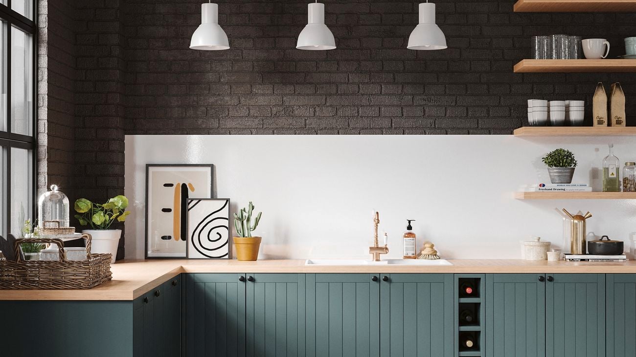 Country, farmhouse style kitchen with rich green cabinets, brass tapware, and matte black accessories]