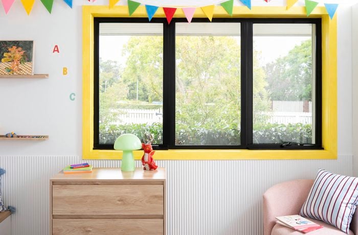 A bright yellow kid-core window trim