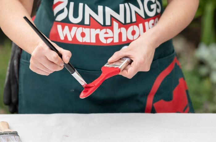 Painting wooden part of the paint brush