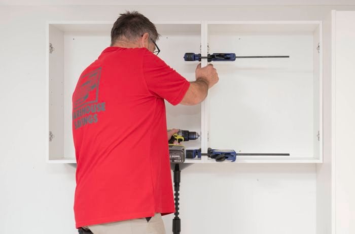  Join multiple cabinets using clamps and a drill 
