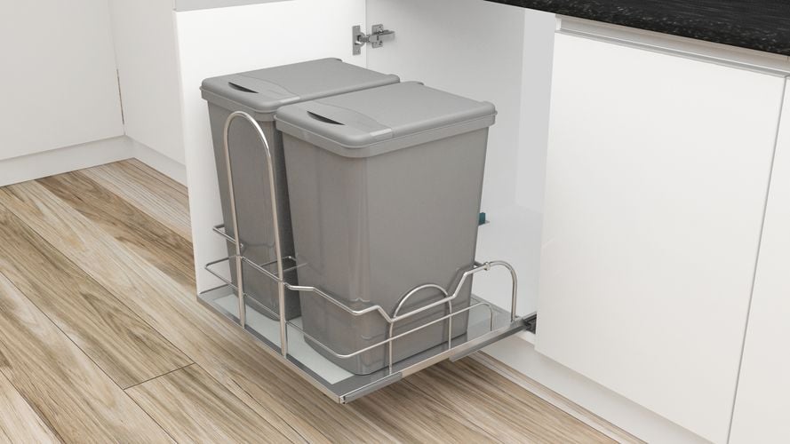 Open kitchen cupboard with pull out shelf for waste bins