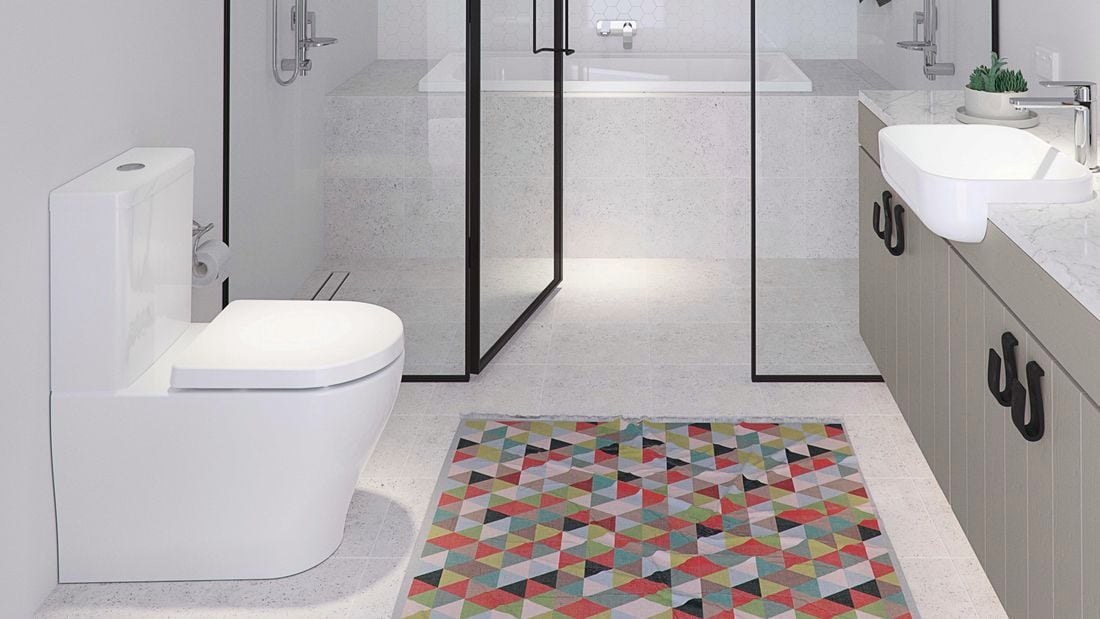 bathroom featuring caroma toilet