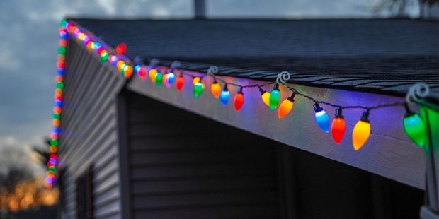 Colourful fairy lights hanging from roof.