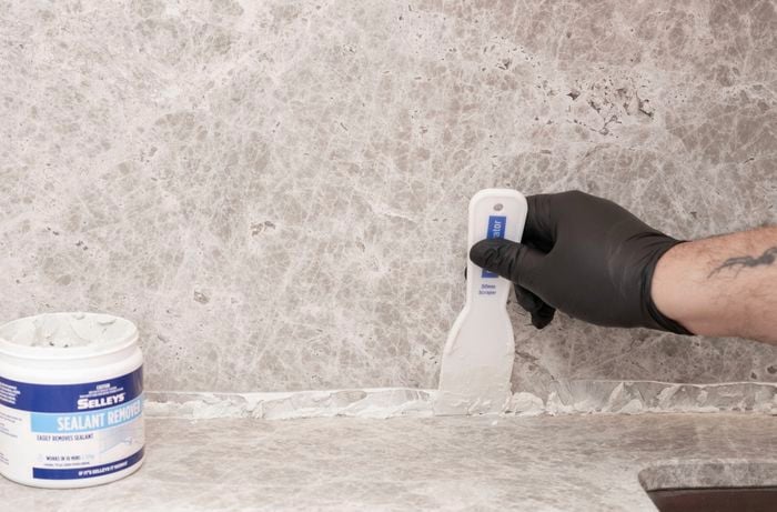 Apply silicone remover to remove remaining sealant residue