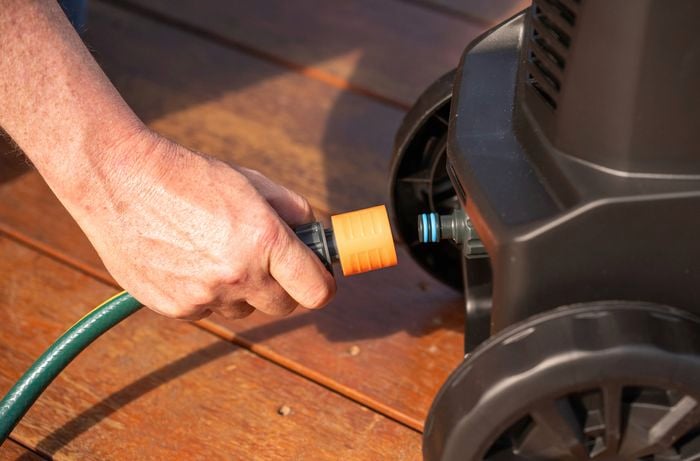 Position the pressure washer and connect the hoses