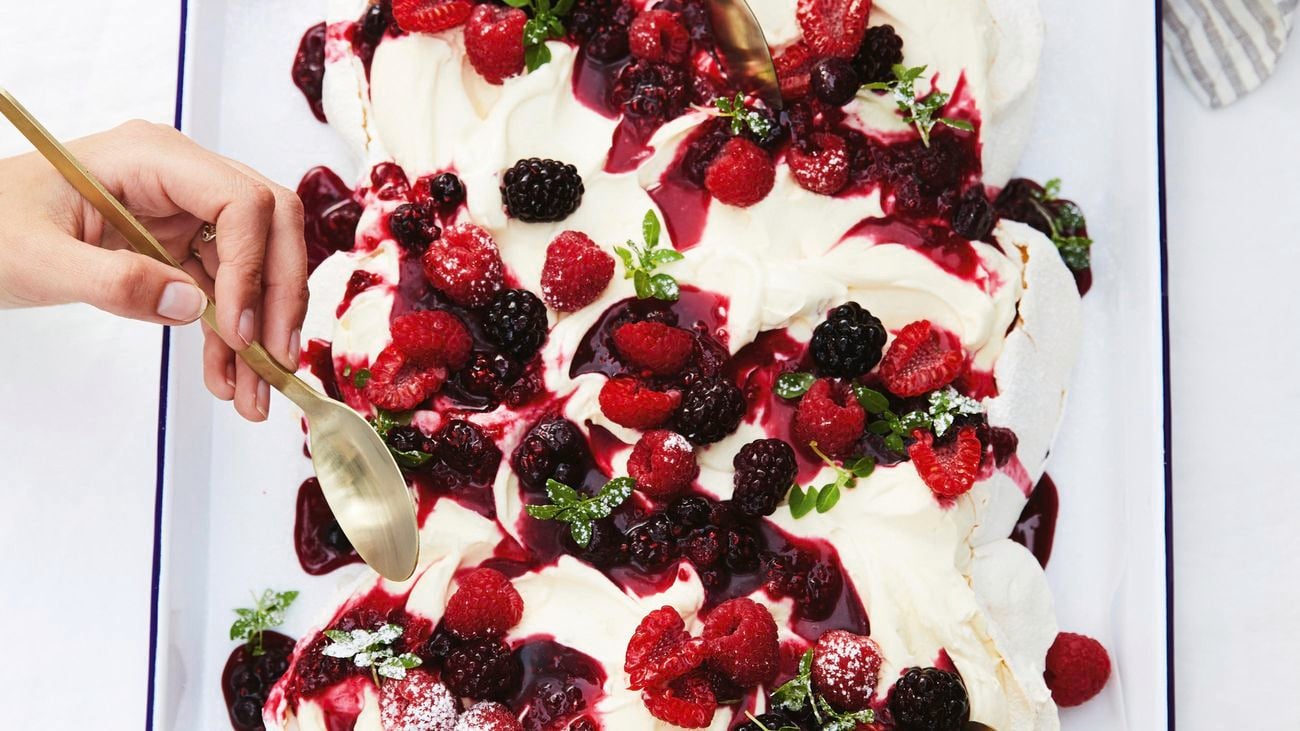 Pavlova with berry sauce.