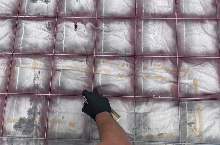 Creating a D.I.Y. photo booth - applying metallic spray paint to the frame mesh.