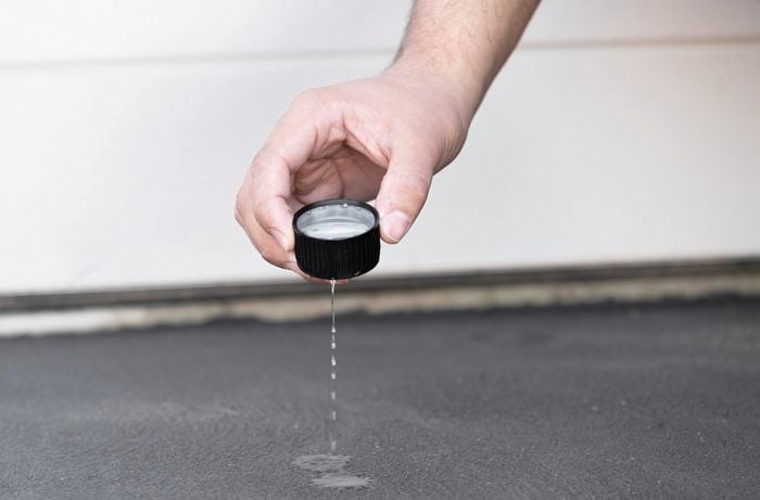 Doing  a porosity test on a driveway