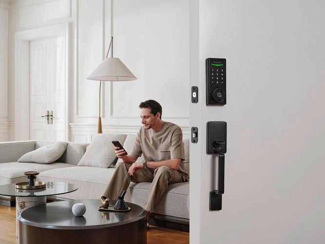 A person with a Philips DIY Smart Lock installed.