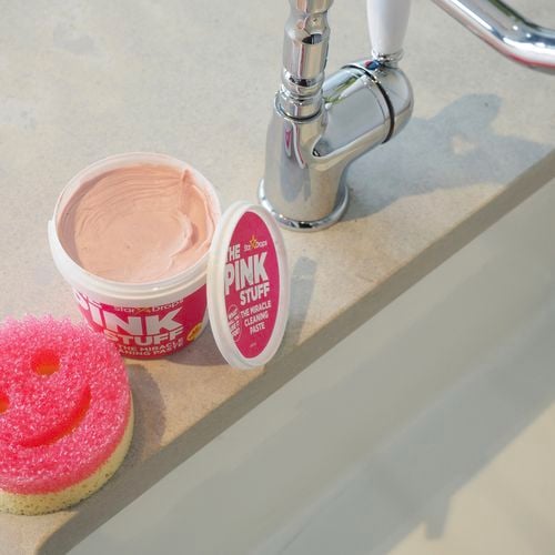 The Pink Stuff cleaning paste near a sink.
