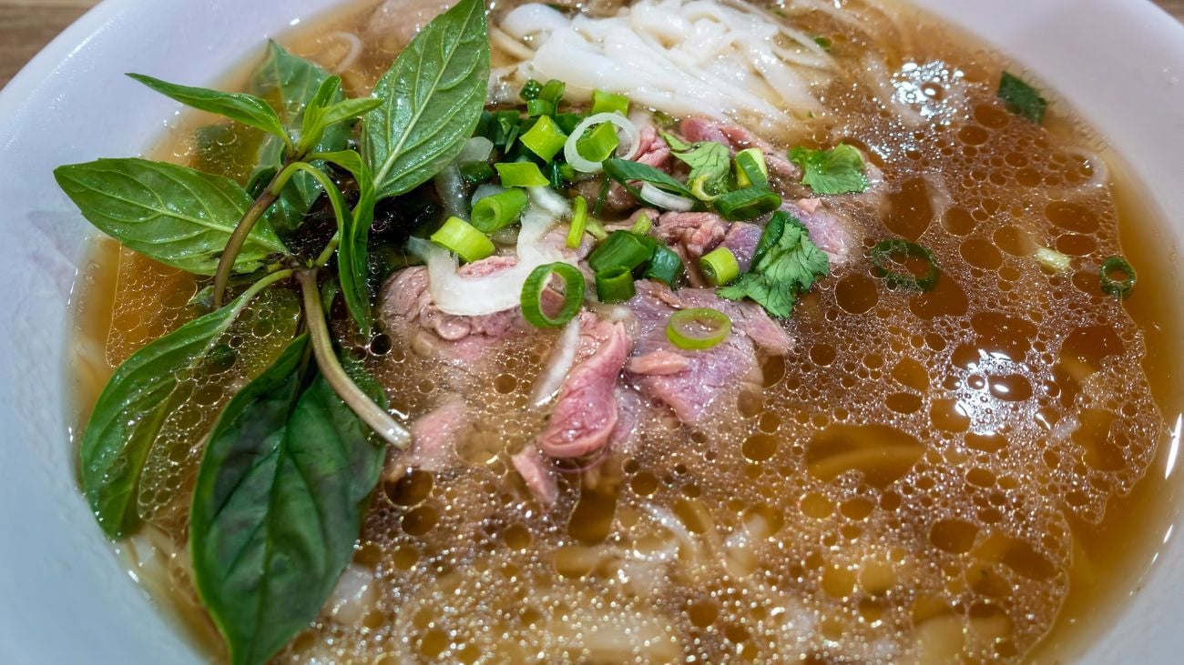 Vietnamese mint being used in cooking a meal.