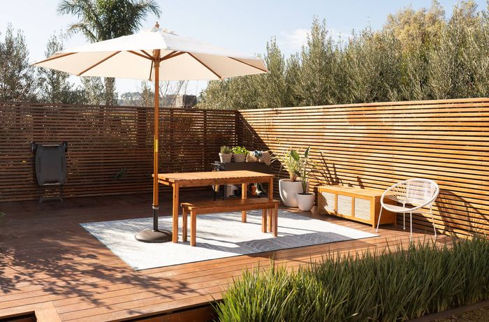 Outdoor storage bench and furniture keeping an entertaining area tidy and organised.