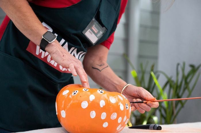 Bunnings team member adding details to the shapes.