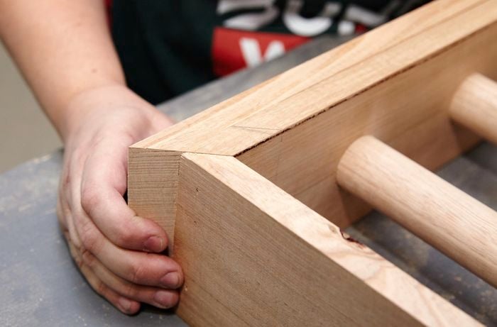 Person lining up two piece of timber