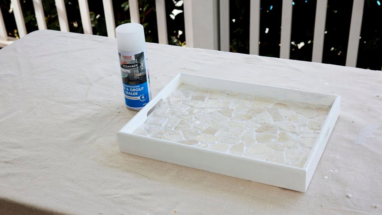A DIY tray with mosaic tiles after a sealer has been applied.