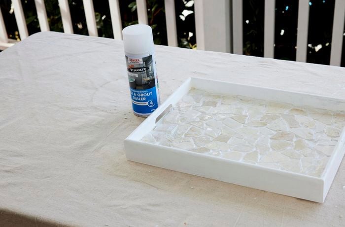 A DIY tray with mosaic tiles after a sealer has been applied.