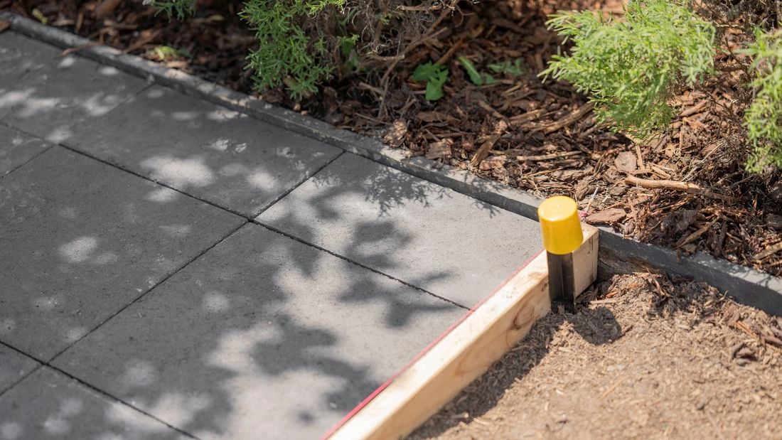 <p><span>A newly installed gray paver pathway with</span><span style="color: rgb(255, 0, 0); font-family: Calibri, Calibri_EmbeddedFont, Calibri_MSFontService, sans-serif; font-size: 11pt">&nbsp;</span></p>