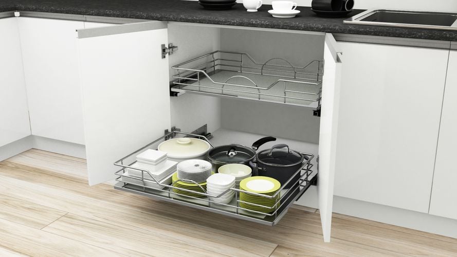 Open kitchen cupboard showing pull out storage shelves for plates and cookware