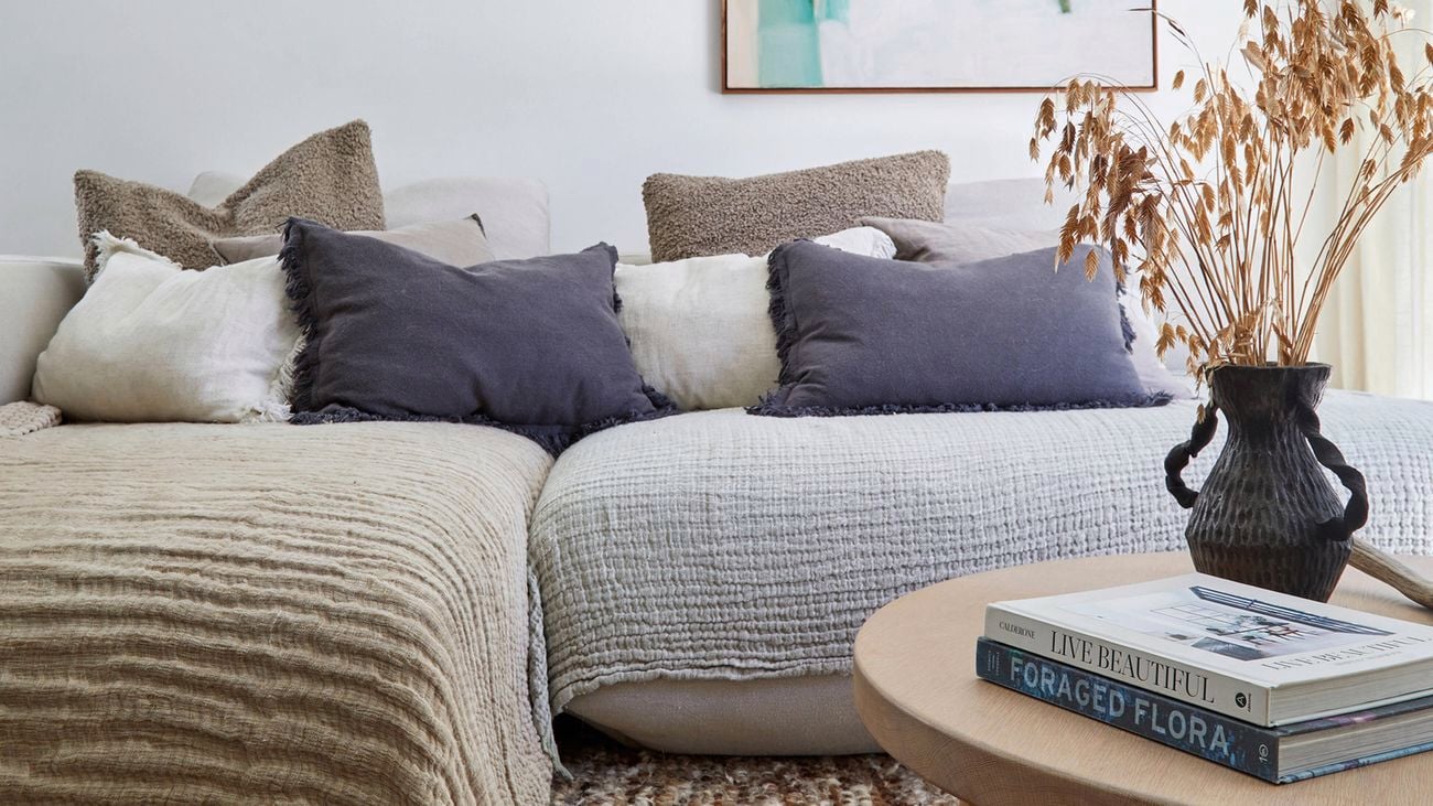 A room with textured throws and pillows will keep your home warm in winter