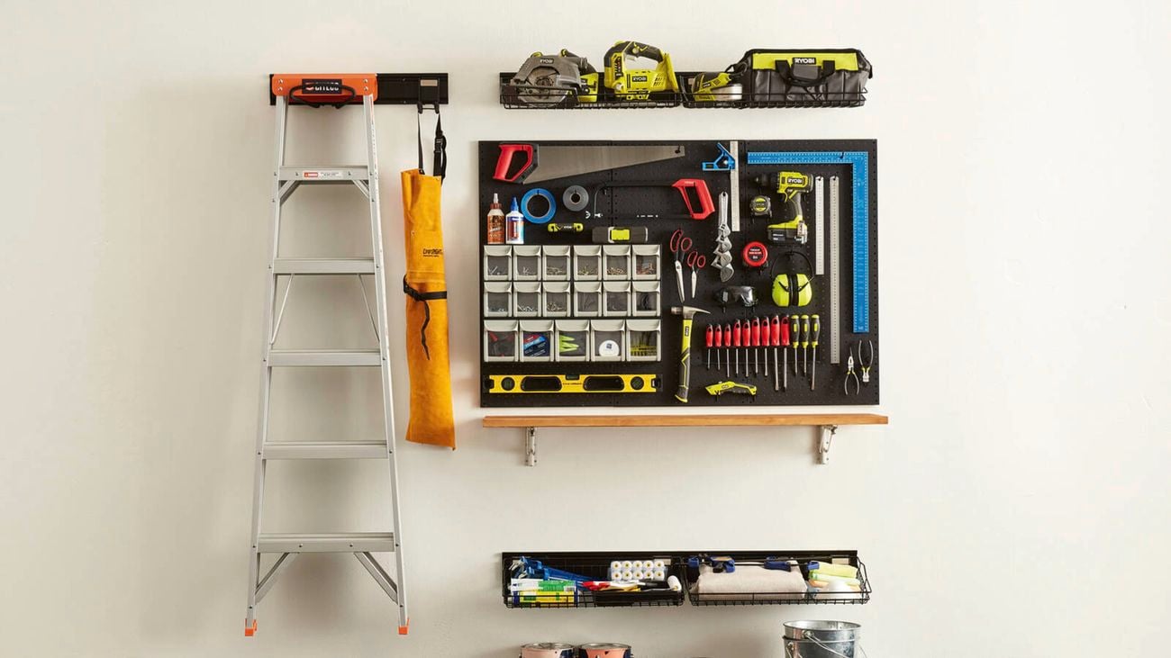 Wall tool storage with tools.