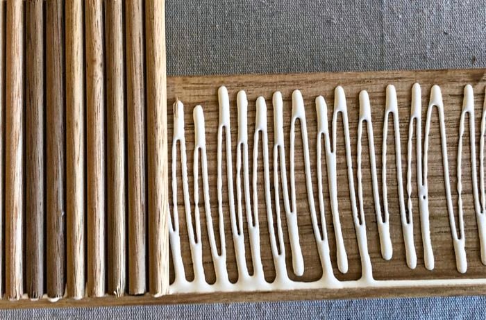 Timber with glue on it, where dowels will be placed.