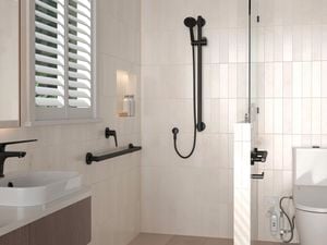 Accessible bathroom with grab rails, tapware and fixtures, illustrating how to upgrade your home for assisted living needs.