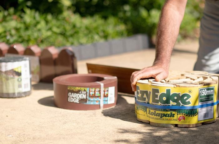 A hand rests on Ezy Edge.