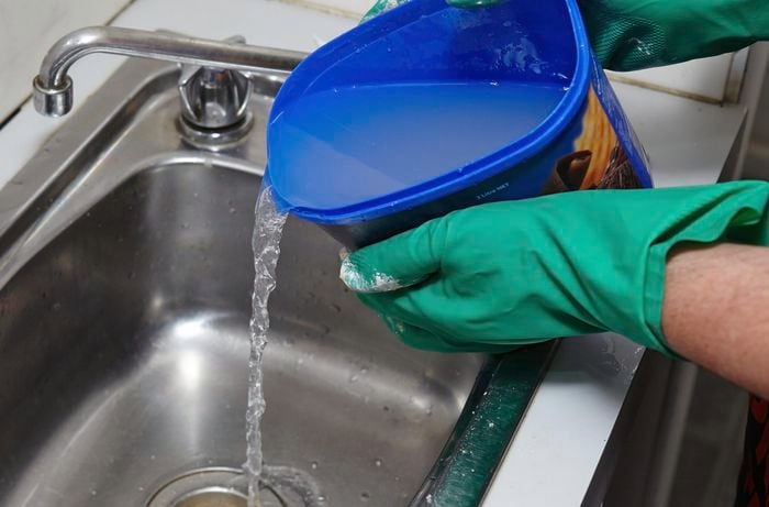 Drain cleaner being used to flush an unblocked drain