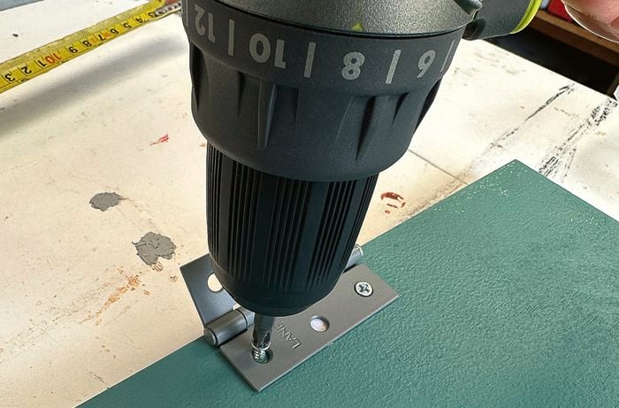 Hinge on door with drill]