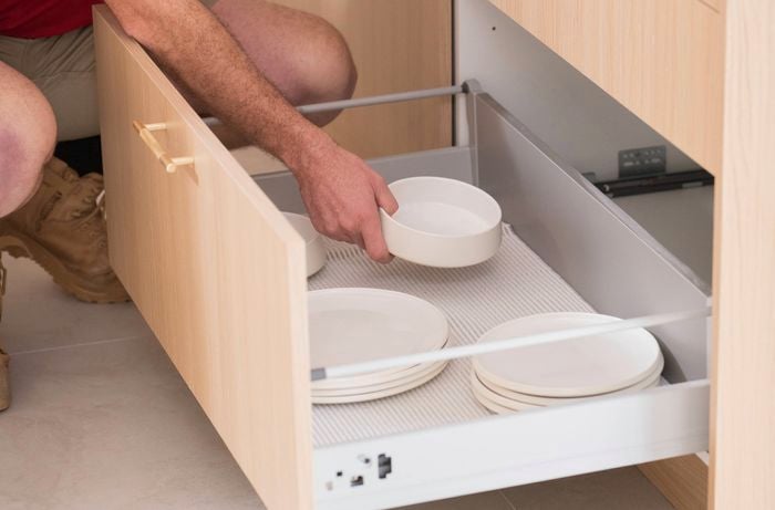 Use drawer and cupboard liners to protect surfaces from leaks, scratches, and crumbs