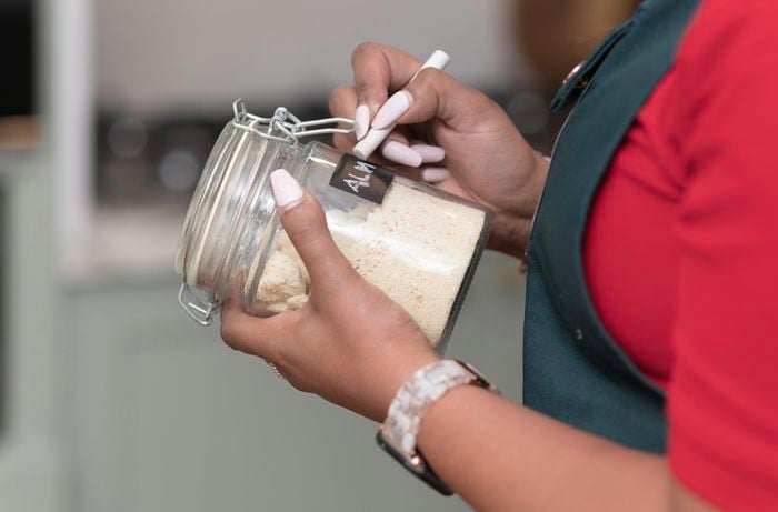 Writing on a chalkboard label on a jar.