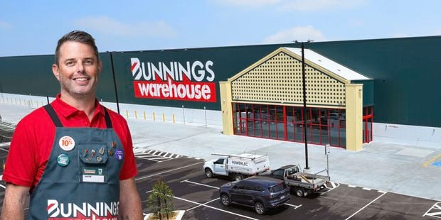 Team member and the front of a Bunnings store.
