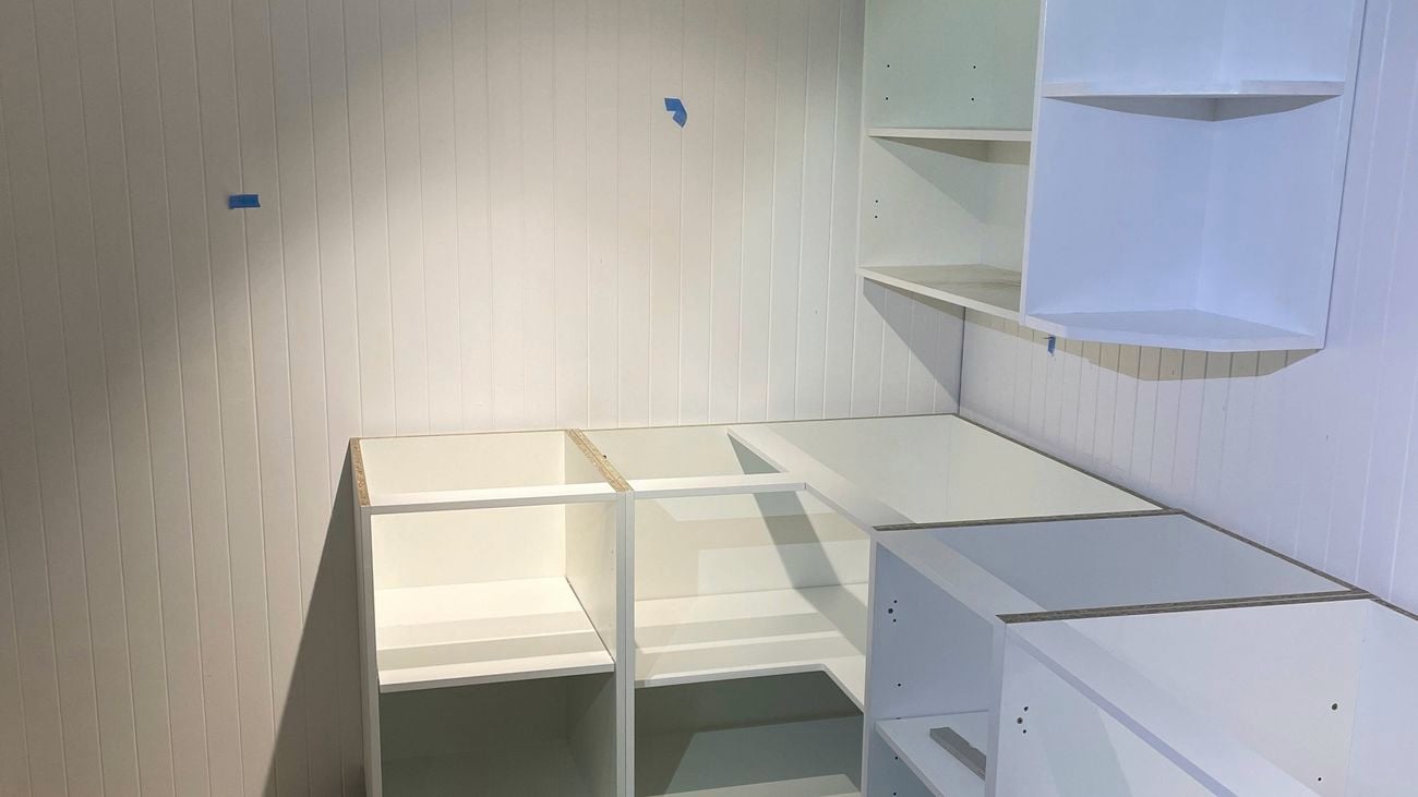 A virtual laundry with shelving in it.