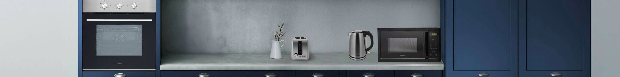 Blue modern kitchen with white benchtop, an oven, microwave, kettle and toaster in it.