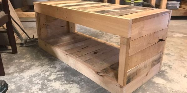 A D.I.Y. timber entertainment unit made from recycled timber in a garage