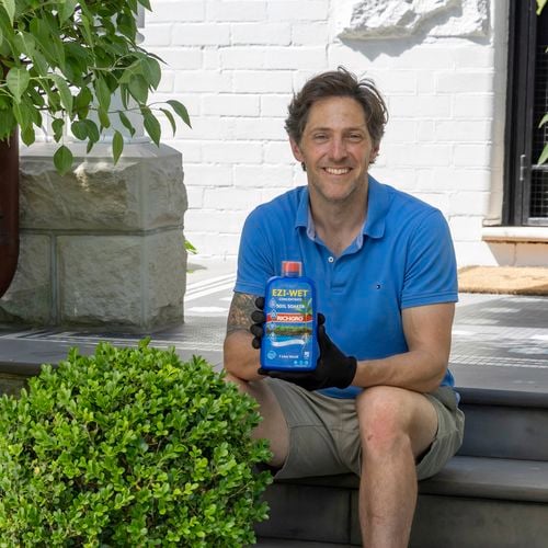 Charlie albone with Ezi wet in use in the garden with gloves