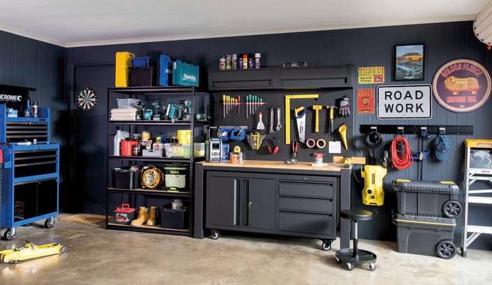 Garage with heavy duty shelving and workbench.
