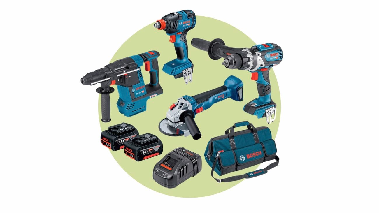 Bosch four-piece power tools combo kit with a duffle bag and batteries on a light green background.