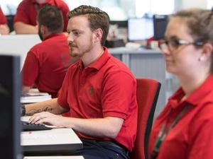Bunnings team members at computers.