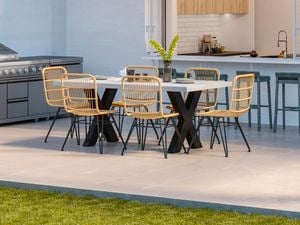 Outdoor wicker set on grey pavers