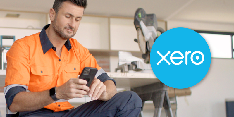 Tradie person with orange Fluro shirt looking at this phone.