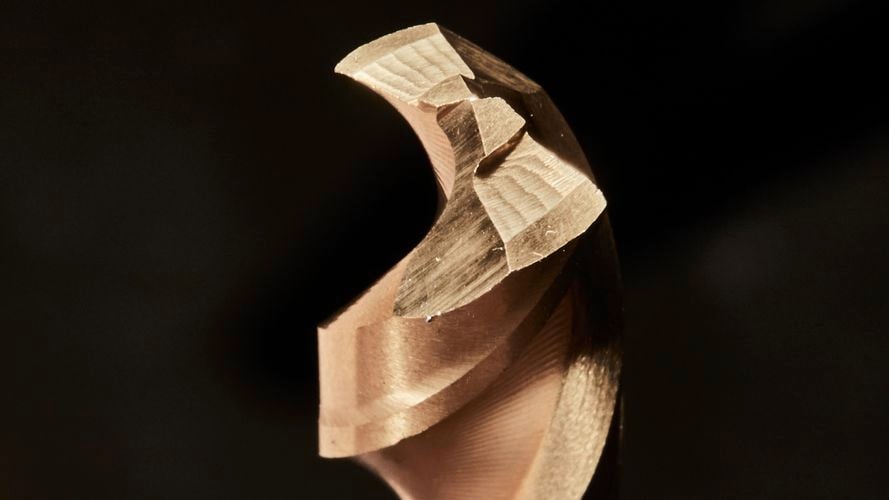 Zoomed in bronze plated drill bit.
