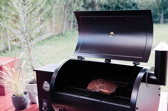 A slab of brisket sitting in a barbecue