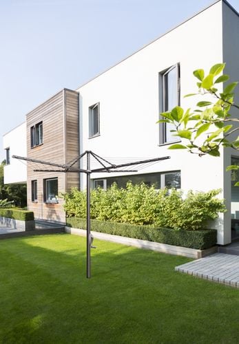 A TopDry clothes hoist in a modern urban backyard