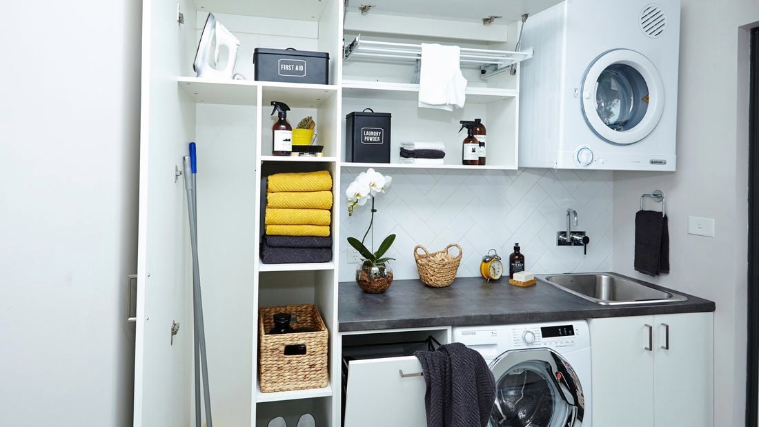 Laundry storage solution featuring the  Flatpax Utility range including a laundry chute and broom cupboard.