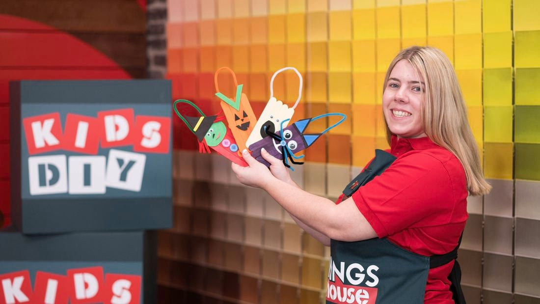 A Bunnings Team Member is holding spooky Halloween popsicle character​​