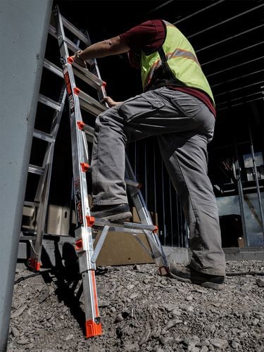 Person with foot on first step of ladder