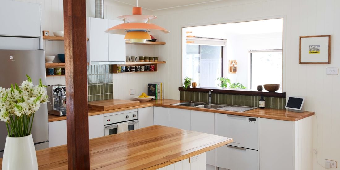 Modern look family kitchen with timber benchtops and warm tones