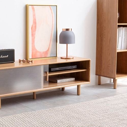 This sleek oak TV unit features fluted glass sliding doors and a minimalist silhouette for a clean, modern look. I/N: 0371576
