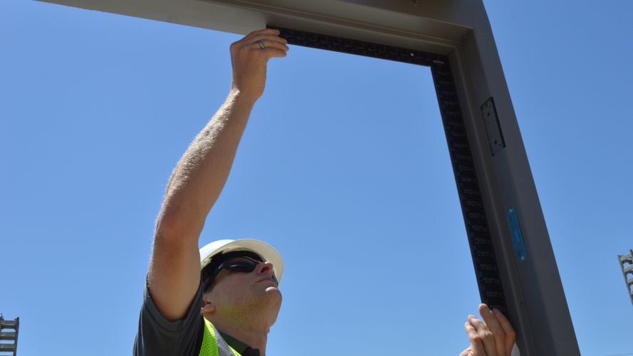 Person using right-angle framing square